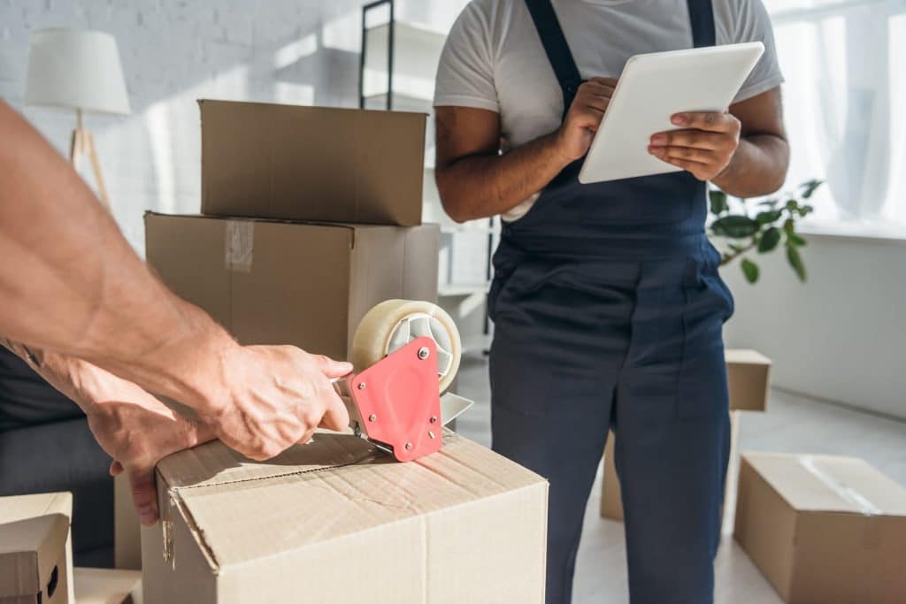Movers packing boxes, professional packing service
